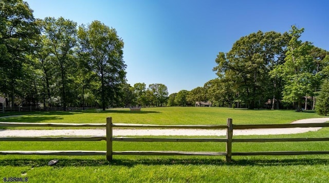 surrounding community featuring a rural view and a yard