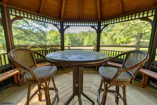 wooden terrace featuring a gazebo