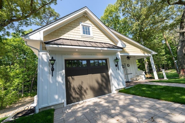 view of front of house featuring a garage and a porch