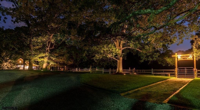 view of yard at dusk