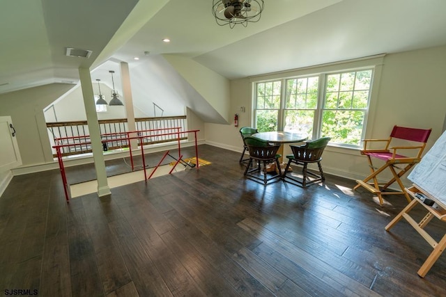 interior space with dark hardwood / wood-style flooring and lofted ceiling