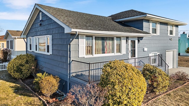 view of side of property with a garage