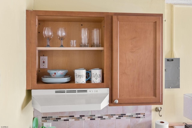 details featuring tasteful backsplash and electric panel