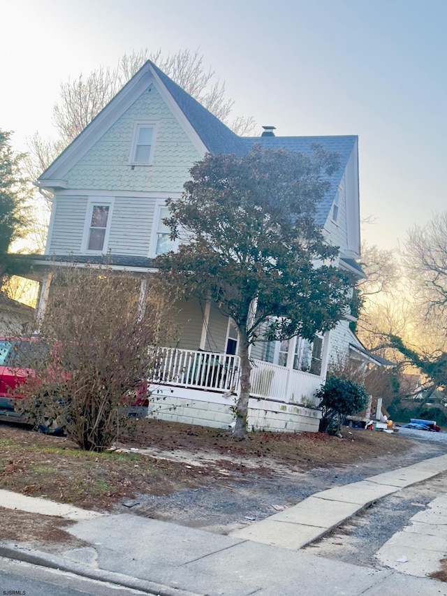 victorian house featuring a porch