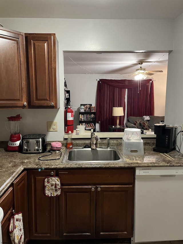 kitchen featuring sink, dark brown cabinets, dishwasher, kitchen peninsula, and ceiling fan