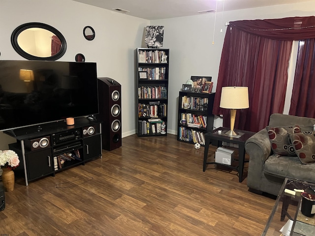 living room with dark hardwood / wood-style flooring