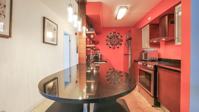 kitchen featuring electric stove, fridge, sink, and light tile patterned floors