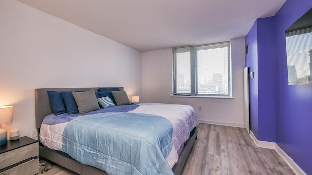 bedroom with light wood-type flooring