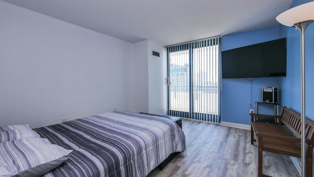 bedroom with wood-type flooring