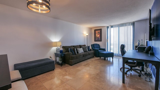 living room featuring floor to ceiling windows and a textured ceiling