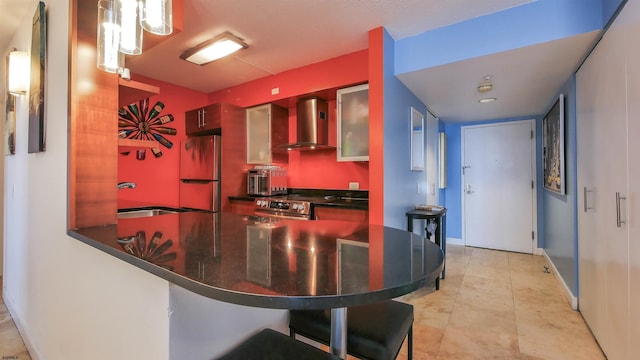 kitchen with sink, stainless steel range with electric stovetop, fridge, kitchen peninsula, and wall chimney exhaust hood