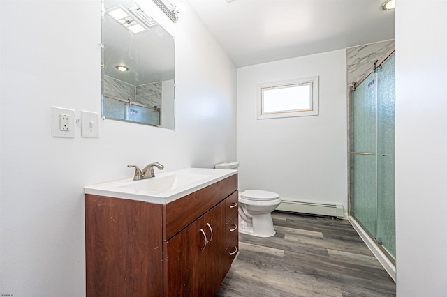 bathroom featuring a shower with door, hardwood / wood-style floors, vanity, a baseboard radiator, and toilet