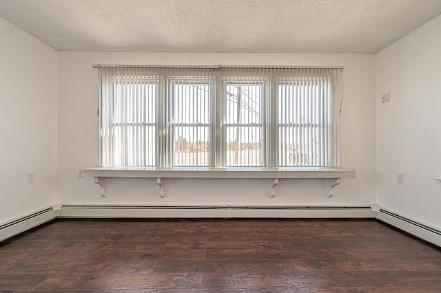 empty room featuring a baseboard radiator, dark hardwood / wood-style floors, and a textured ceiling