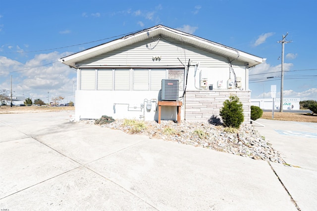 view of property exterior with central AC unit