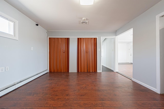 interior space featuring dark hardwood / wood-style floors and baseboard heating