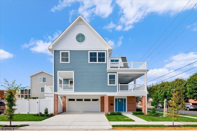 view of front of home with a balcony and a garage