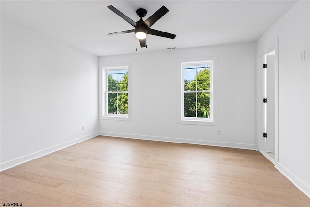 empty room featuring ceiling fan and light wood-type flooring