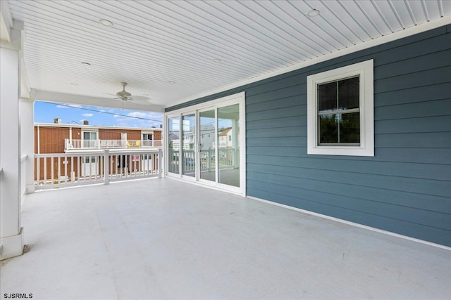 view of patio featuring ceiling fan