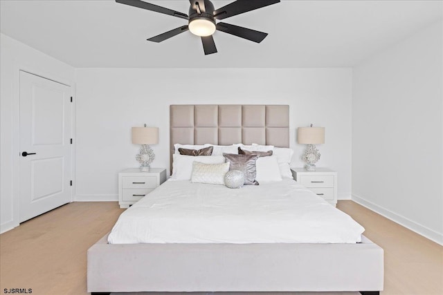 bedroom with light colored carpet and ceiling fan