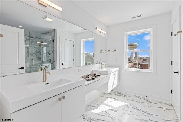 bathroom featuring vanity and a shower with shower door