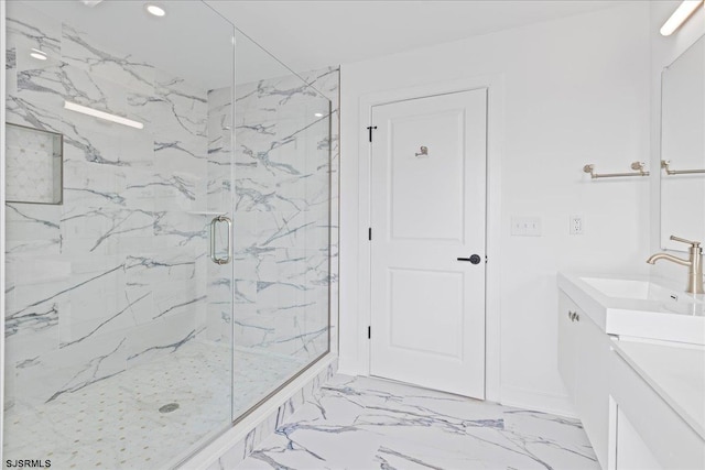 bathroom featuring vanity and a shower with shower door