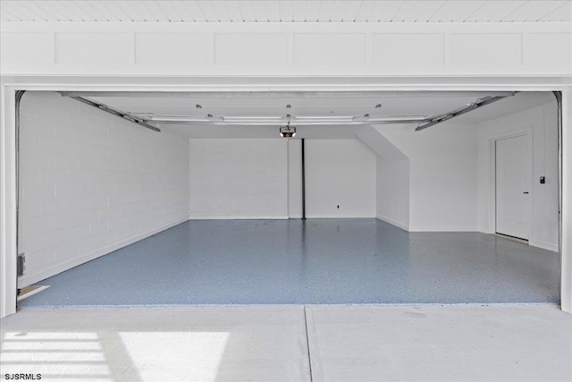 garage with a carport and a garage door opener