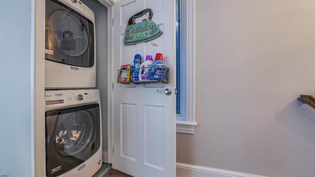 washroom featuring stacked washing maching and dryer