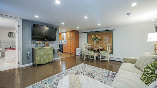 living room featuring dark hardwood / wood-style floors and baseboard heating