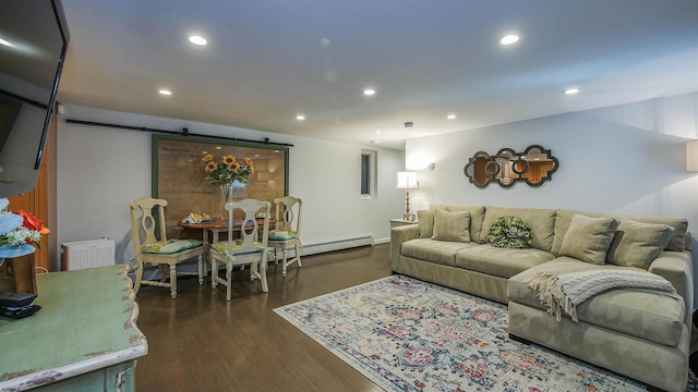 living room with a barn door and dark wood-type flooring