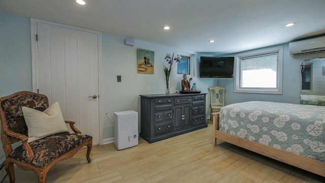 bedroom featuring a wall mounted AC