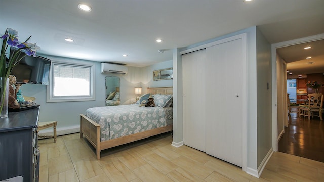 bedroom with a wall mounted AC and a closet