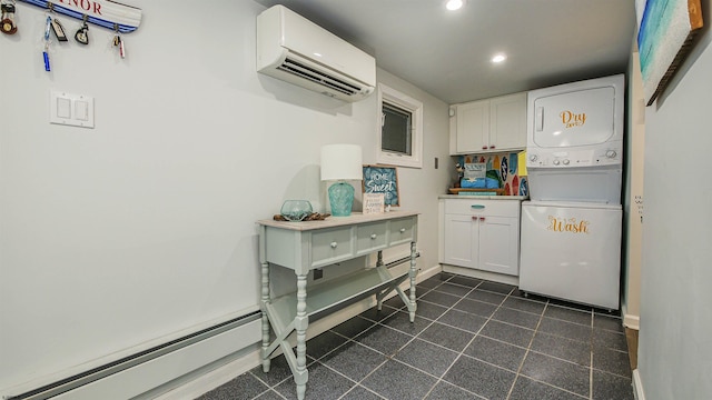 kitchen with stacked washer / drying machine, a wall mounted AC, and white cabinets