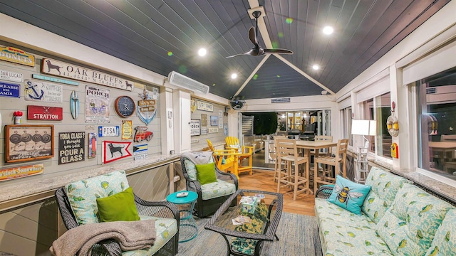 interior space featuring lofted ceiling, hardwood / wood-style floors, wooden ceiling, and ceiling fan