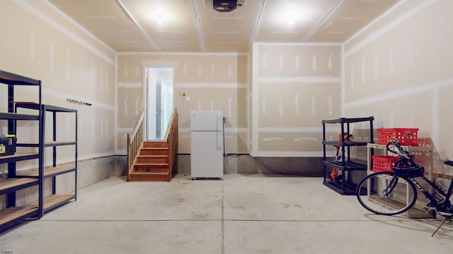 garage featuring white fridge