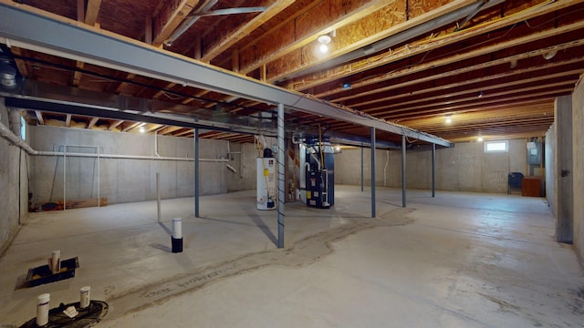 basement featuring heating unit and water heater