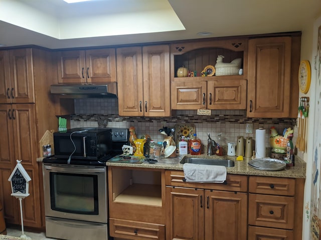 kitchen featuring brown cabinets, decorative backsplash, under cabinet range hood, open shelves, and stainless steel electric range oven