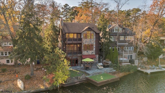 back of house featuring a water view