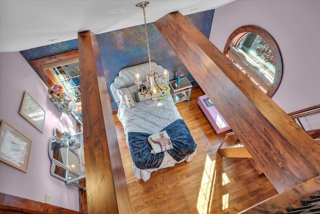 living room featuring an inviting chandelier and wood-type flooring