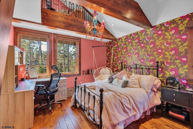 bedroom with hardwood / wood-style flooring and lofted ceiling