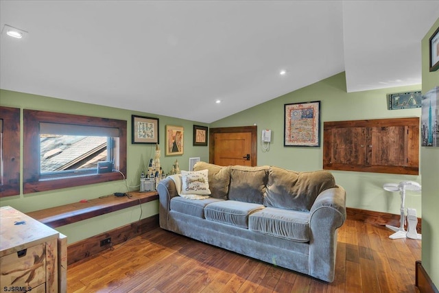 living room featuring hardwood / wood-style floors and vaulted ceiling