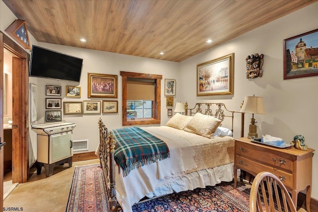 carpeted bedroom featuring wooden ceiling