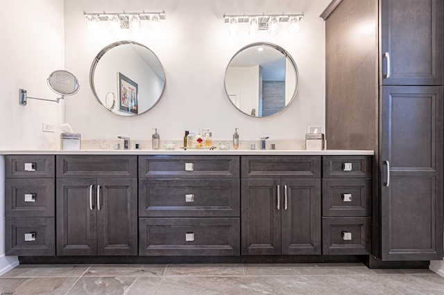 bathroom featuring tile patterned flooring and vanity