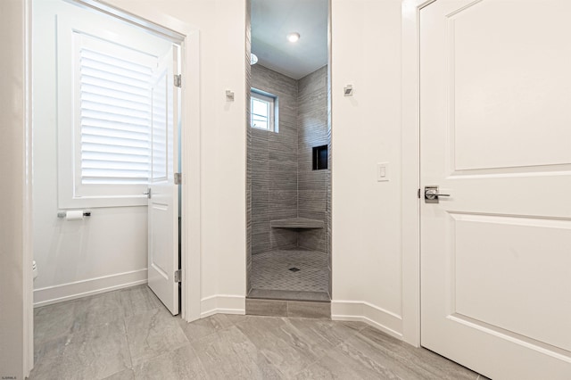 bathroom featuring tiled shower