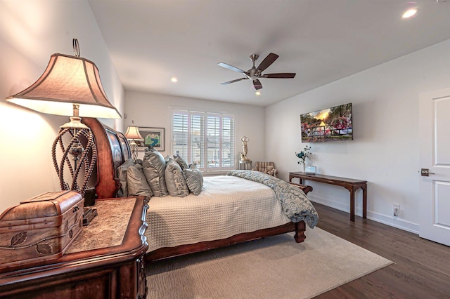 bedroom featuring dark hardwood / wood-style floors and ceiling fan