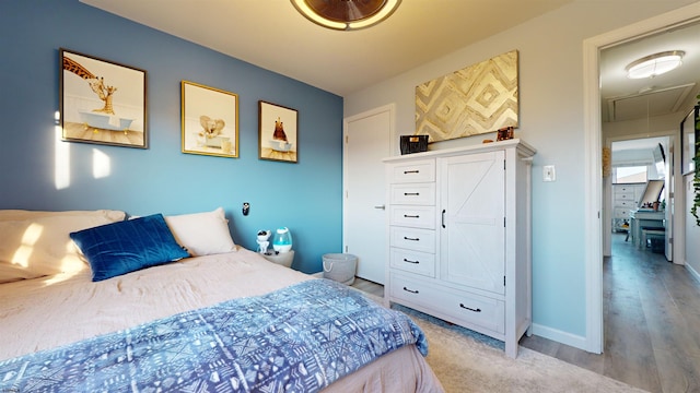 bedroom with light wood-type flooring