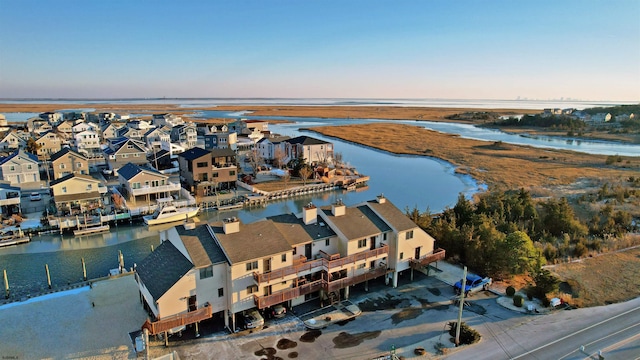 aerial view at dusk with a water view