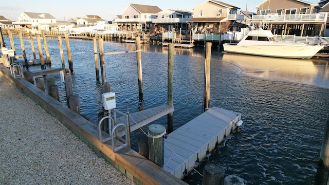 dock area with a water view