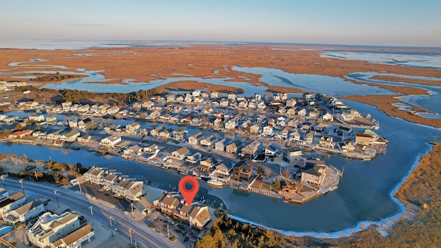 aerial view at dusk with a water view