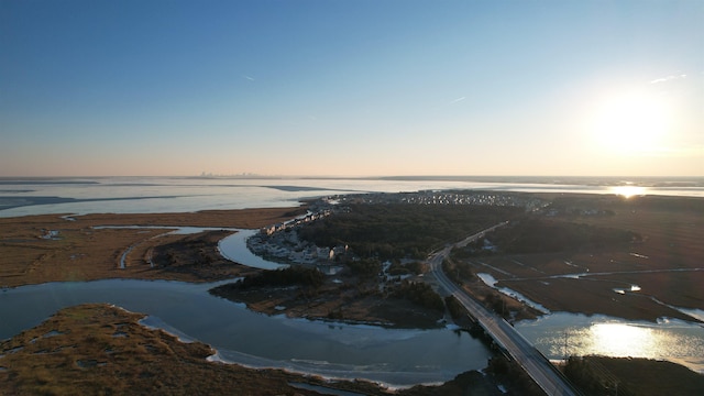 aerial view at dusk with a water view