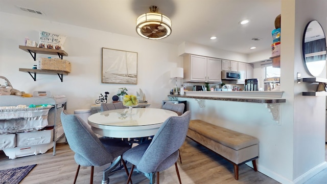 dining area with light wood-type flooring